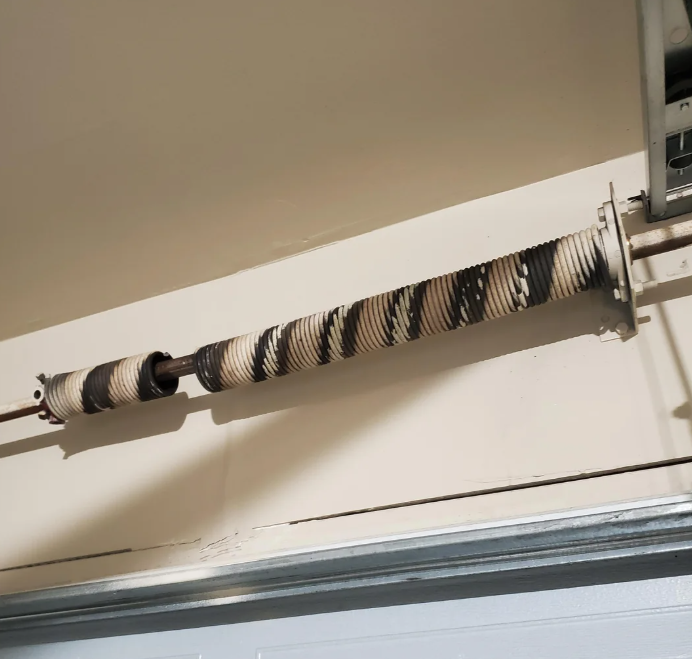 Garage door spring repair service.